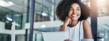 young woman in office on tablet