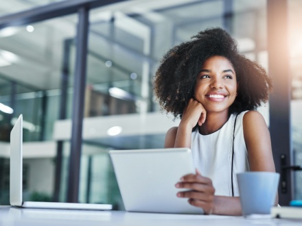 young woman in office on tablet