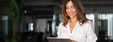 woman standing with tablet