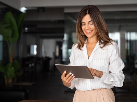 woman standing with tablet