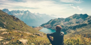 hiker sitting down taking in mountain views