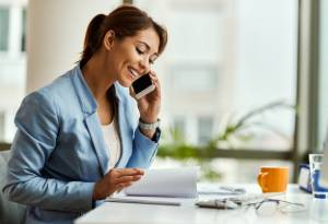 Employee at the phone smiling