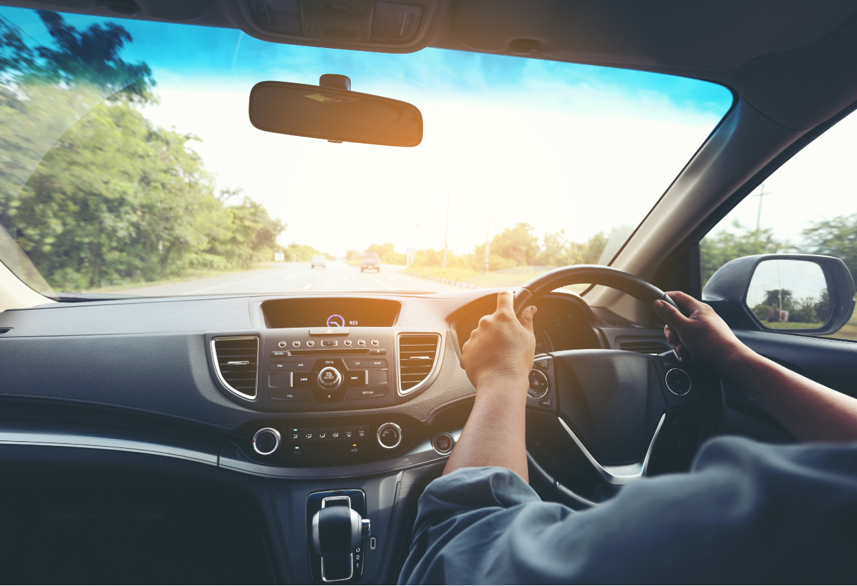 man driving car