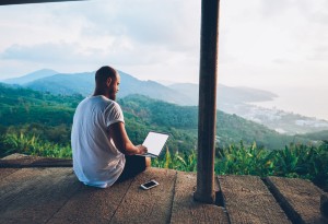 man on holiday with laptop