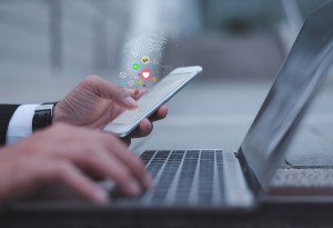 man on phone and laptop